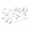 Зображення Набір Feral Feelings BDSM Kit 7 White, наручники, поножі, конектор, маска, падл, кляп, затискачі